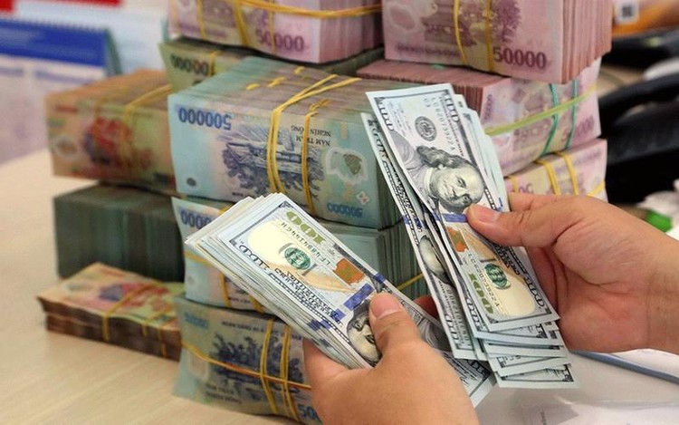 Trong phiên giao dịch 9/12, Ngân hàng Nhà nước điều chỉnh giảm tỷ giá trung tâm của đồng Việt Nam so với USD