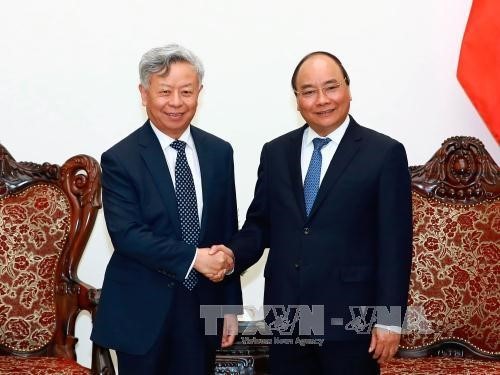 Thủ tướng Nguyễn Xuân Phúc tiếp ông Kim Lập Quần, Chủ tịch Ngân hàng Đầu tư Cơ sở hạ tầng châu Á (AIIB). Ảnh: Thống Nhất/TTXVN