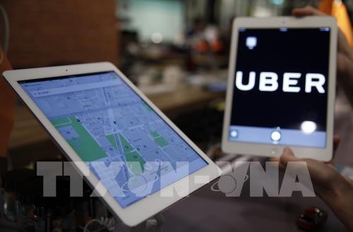 Uber là một trong các đơn vị được phép thí điểm ứng dụng công nghệ vào kinh doanh vận tải hành khách tại Hà Nội. EPA/TTXVN