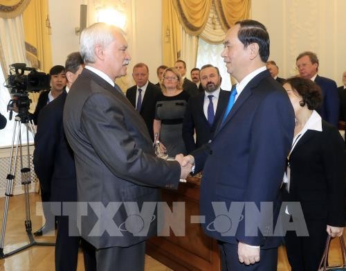 Chủ tịch nước Trần Đại Quang gặp Thống đốc thành phố Saint Peterburg I. Poltavchenko. Ảnh: Nhan Sáng - TTXVN