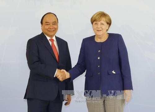 Thủ tướng Nguyễn Xuân Phúc và Thủ tướng Angela Merkel. Ảnh: TTXVN