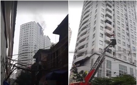 Khói bốc cao từ cửa sổ căn hộ bị cháy, lực lượng PCCC dùng xe thang tiếp cận hiện trường - Ảnh: FB