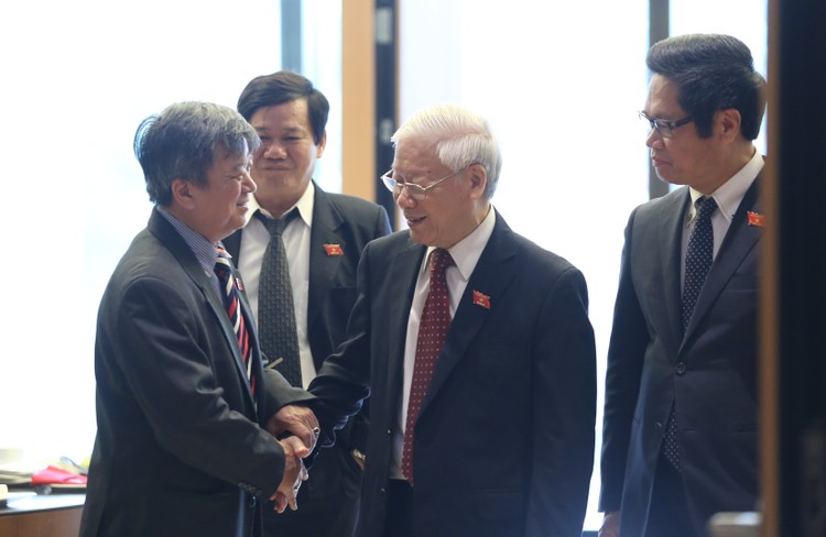 Tổng Bí thư Nguyễn Phú Trọng cùng các đại biểu dự phiên khai mạc kỳ họp Quốc hội. - Ảnh: VGP