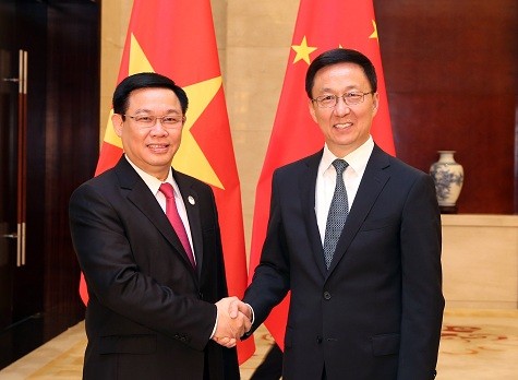 Phó Thủ tướng Vương Đình Huệ và Phó Thủ tướng Trung Quốc Hàn Chính - Ảnh: VGP