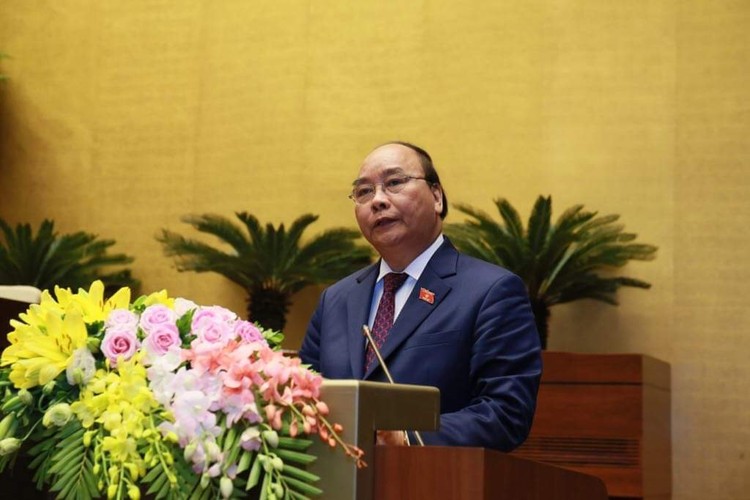 Thủ tướng Nguyễn Xuân Phúc trình bày báo cáo trước Quốc hội về tình hình KTXH 2018 - Ảnh: VGP