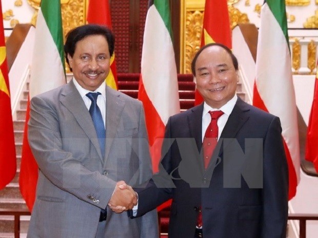 Thủ tướng Nguyễn Xuân Phúc và Thủ tướng Kuwait Sheikh Jaber Mubarak Al-Hamad Al-Sabad. (Ảnh: Thống Nhất/TTXVN)