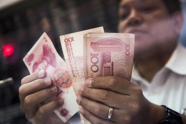 Các công ty Trung Quốc đang tích cực đổ tiền ra nước ngoài. Ảnh:Bloomberg