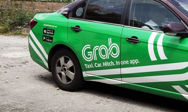 Grab hiện là đối thủ lớn nhất của Uber tại Đông Nam Á. Ảnh:Bloomberg