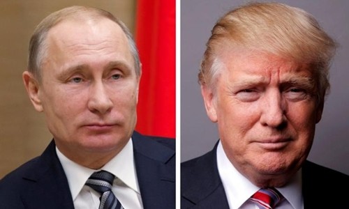 Tổng thống Nga Vladimir Putin (trái) và người đồng cấp Mỹ Donald Trump. Ảnh:Reuters.
