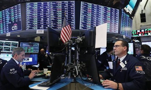 Nhân viên môi giới trên sàn NYSE của Mỹ. Ảnh:AFP