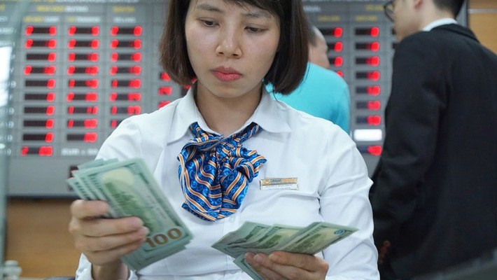 Ngân hàng Nhà nước đã mua vào hơn 32 tỷ USD trong khoảng hai năm qua - Ảnh: Quang Phúc.