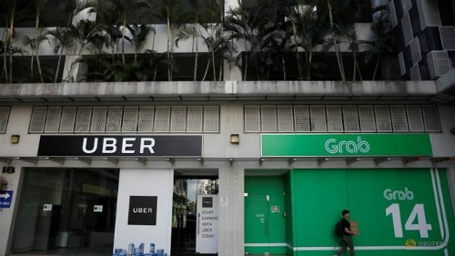 Một góc văn phòng của Uber và Grab chụp vào ngày 26/3/2018.Ảnh: Reuters