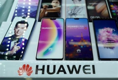 Biểu tượng của khổng lồ viễn thông Huawei, Trung Quốc. Ảnh: AFP/TTXVN