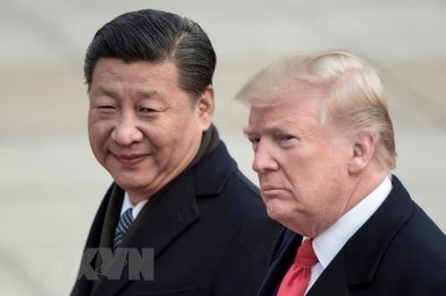 Chủ tịch Trung Quốc Tập Cận Bình (trái) đón Tổng thống Mỹ Donald Trump trong chuyến thăm Trung Quốc tại Bắc Kinh ngày 9/11/2017. (Nguồn: AFP/TTXVN)
