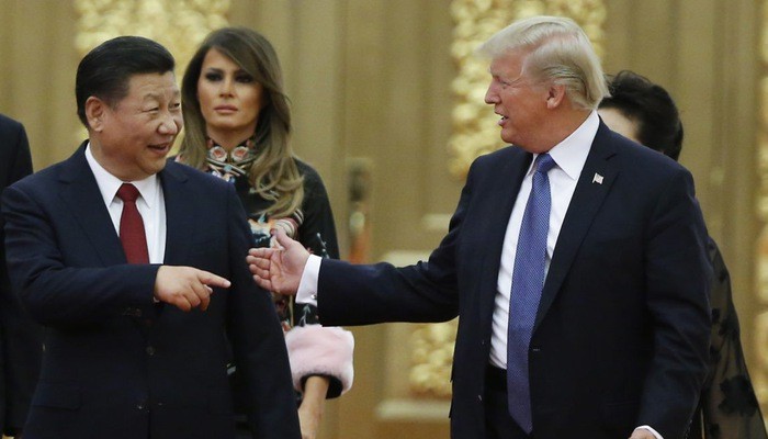 Tổng thống Mỹ Donald Trump (phải) và Chủ tịch Trung Quốc Tập Cận Bình trong cuộc gặp ở Bắc Kinh tháng 11/2017 - Ảnh: Getty.
