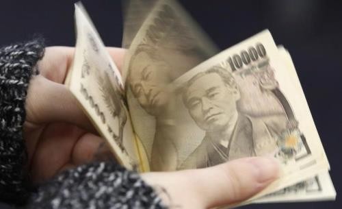 Nhật Bản giữ nguyên chính sách tiền tệ siêu nới lỏng. Ảnh: reuters