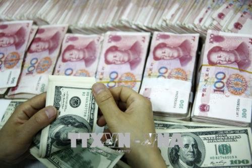 Sáng nay giá USD giảm và giá đồng Nhân dân tệ (CNY) tăng mạnh. Ảnh: Reuters/ TTXVN