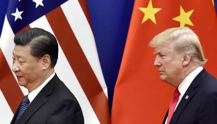 Chủ tịch Trung Quốc Tập Cận Bình (trái) và Tổng thống Mỹ Donald Trump - Ảnh: Kyodo.