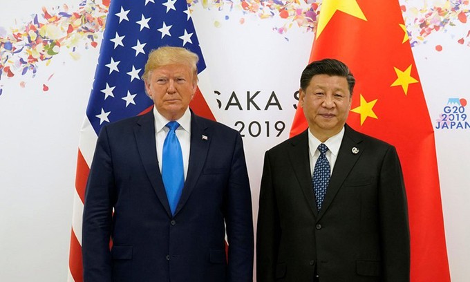 Tổng thống Mỹ Donald Trump (trái) và Chủ tịch Trung Quốc Tập Cận Bình tại hội nghị G20 ở Osaka, Nhật Bản, hồi tháng 6/2019. Ảnh: Reuters.