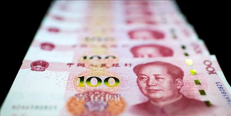Đồng tiền mệnh giá 100 Nhân dân tệ tại Bắc Kinh, Trung Quốc ngày 14/1/2020. Ảnh: AFP/TTXVN