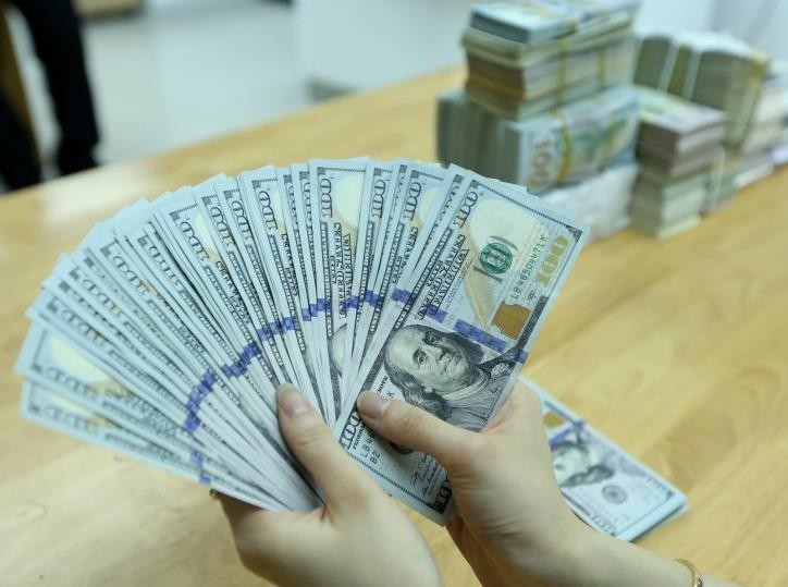 Giá USD tại Vietcombank sáng nay 17/5 tăng 10 đồng. Ảnh minh họa: BNEWS/TTXVN