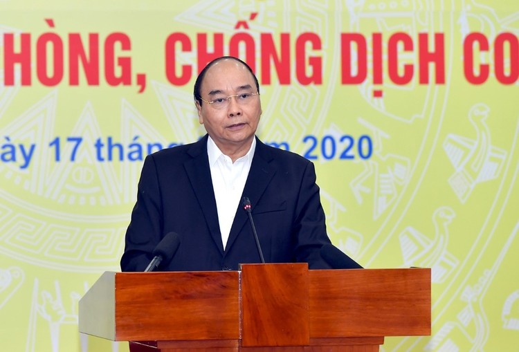 Thủ tướng Chính phủ Nguyễn Xuân Phúc nhấn mạnh: “Việt Nam đang đứng trước những thời khắc quan trọng, đang phải đối mặt với đại dịch Covid-19 ở quy mô toàn cầu". Ảnh: Ngân hàng Nhà nước 